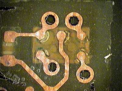 First flat section (just below the solder, looking up through the copper traces)