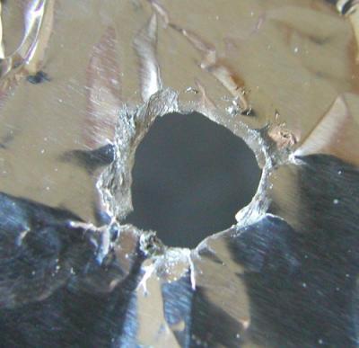 Gallium is corrosive to aluminum. This picture was taken after gallium reacted with a sheet of aluminum foil. Image source: http://sci-toys.com/scitoys/scitoys/thermo/liquid_metal/liquid_metal.html