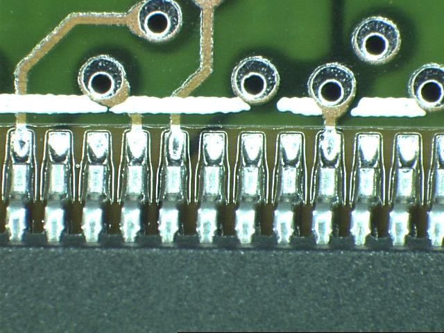 Component leads soldered to a printed circuit board.