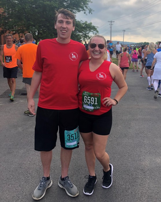 2019 Marketing Communications Intern, Zach Carrier and I waiting for the 15K race to start.