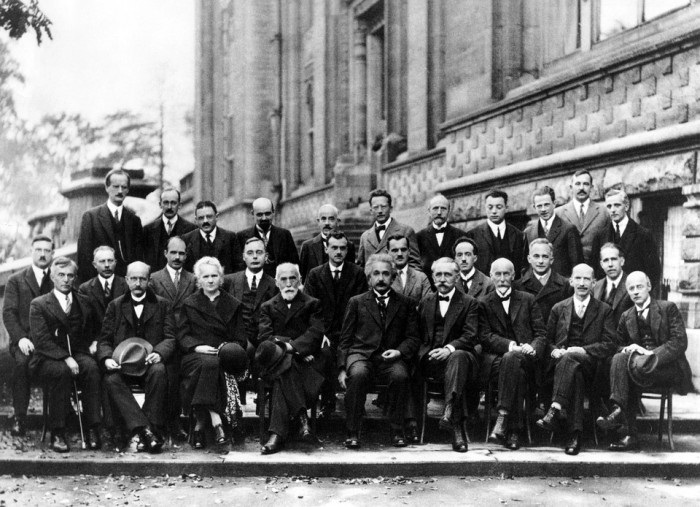 1927, Solvay Conference; bottom row, third from left: Marie Curie - woman physicist and chemist who conducted pioneering research on radioactivity. Also the first woman to receive a Nobel Prize (first person and only woman to ever to receive two).