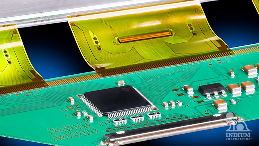 Close-up of an electronic circuit board featuring a black microchip and yellow flexible connectors, showcasing precision work likely achieved through hot bar soldering.