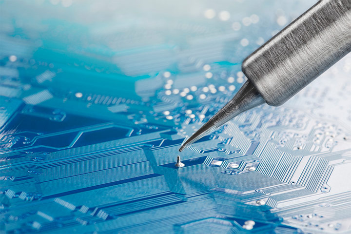 Soldering iron on printed circuit board