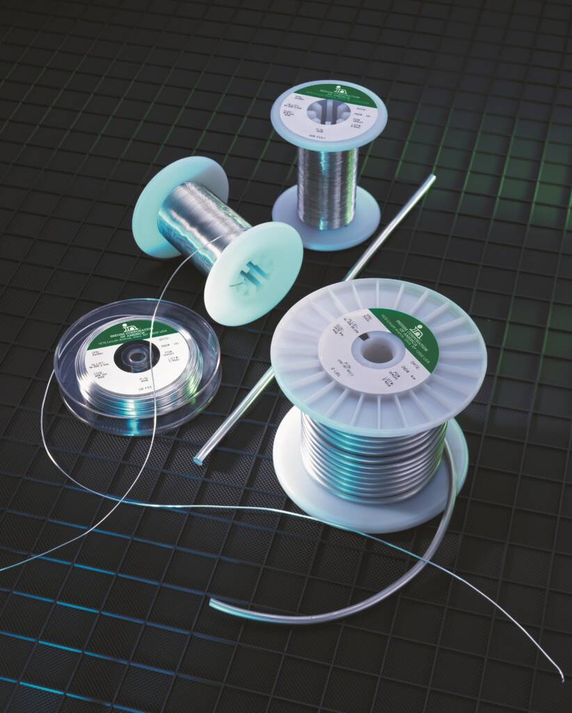 Gold-alloy wire spools and rod array.