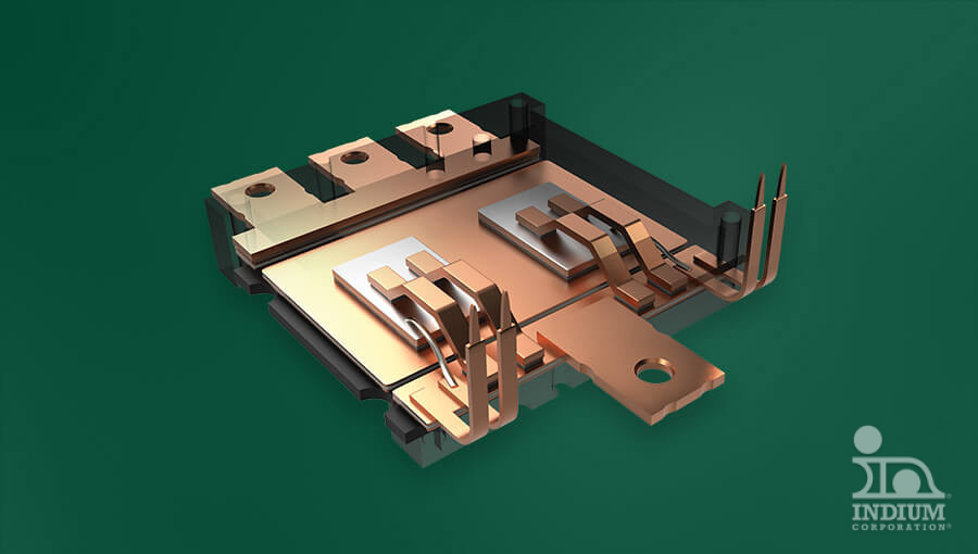 Close-up of a copper electrical component with multiple connectors on a green background.