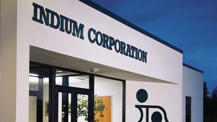 Entrance of Indium Corporation building with large logo and glass doors.