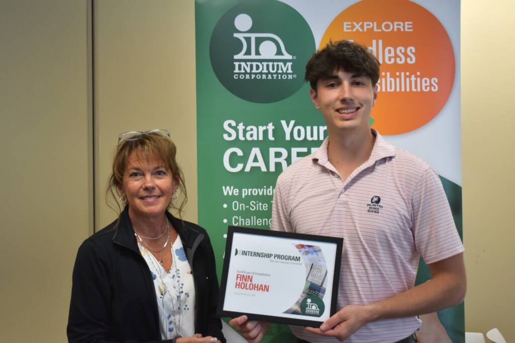 Business Systems Analyst intern, Finn Holohan celebrating his professional growth at Indium Corporation